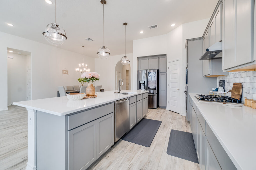 Finished kitchen remodel with island, modern cabinetry, and updated appliances