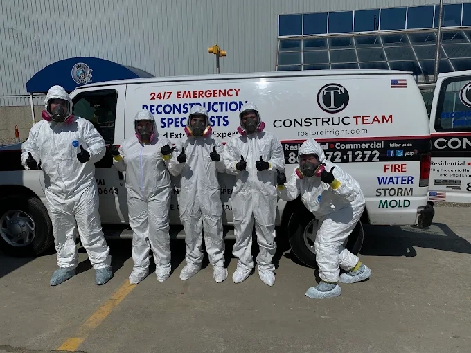 CONSTRUCTEAM team members in protective suits for restoration work
